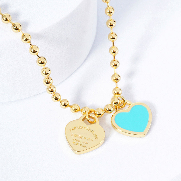 DOUBLE HEARTS ON BALL CHAIN - Gold