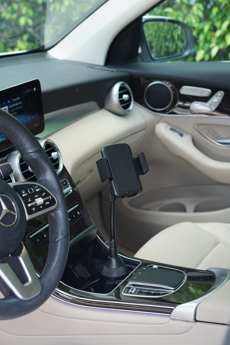 Car interior with a phone holder on the dashboard