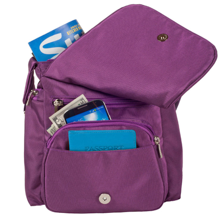 Purple bag with various items inside on a white background