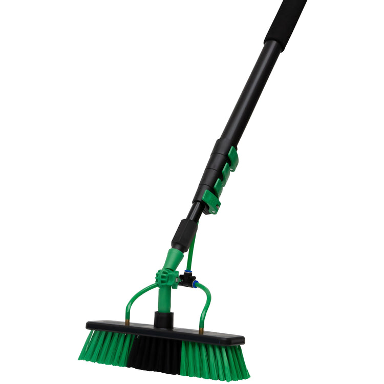 Green and black broom with extendable handle on a white background