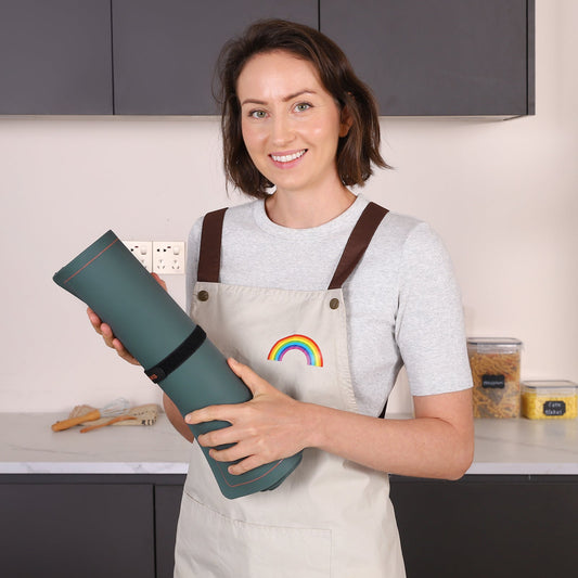 Green heating mat with a control device on a white background