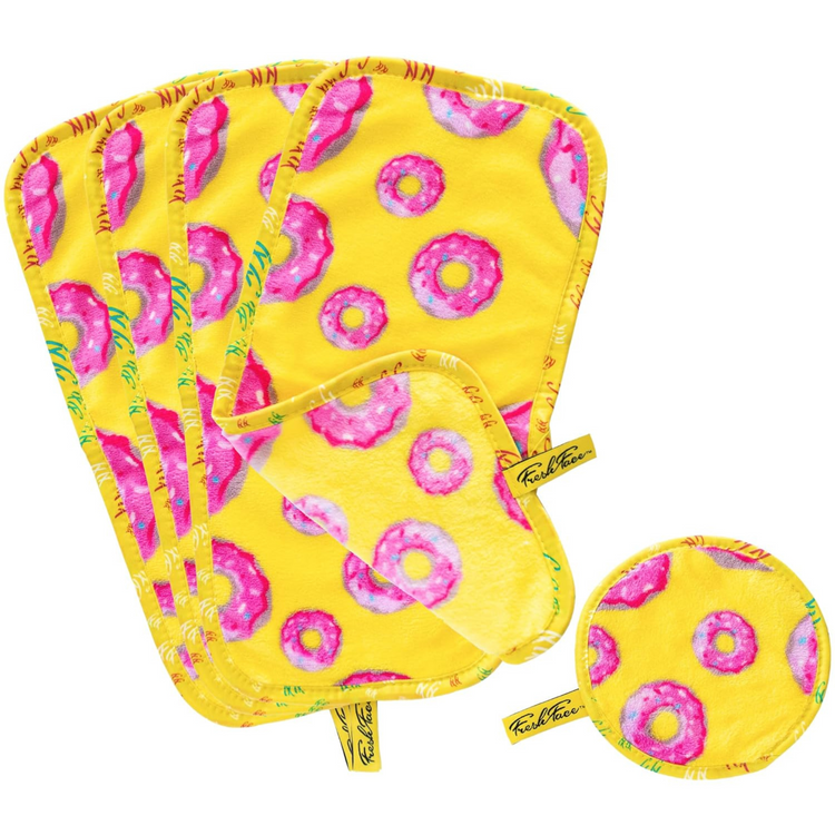 Set of yellow potholders with pink donut pattern on a white background