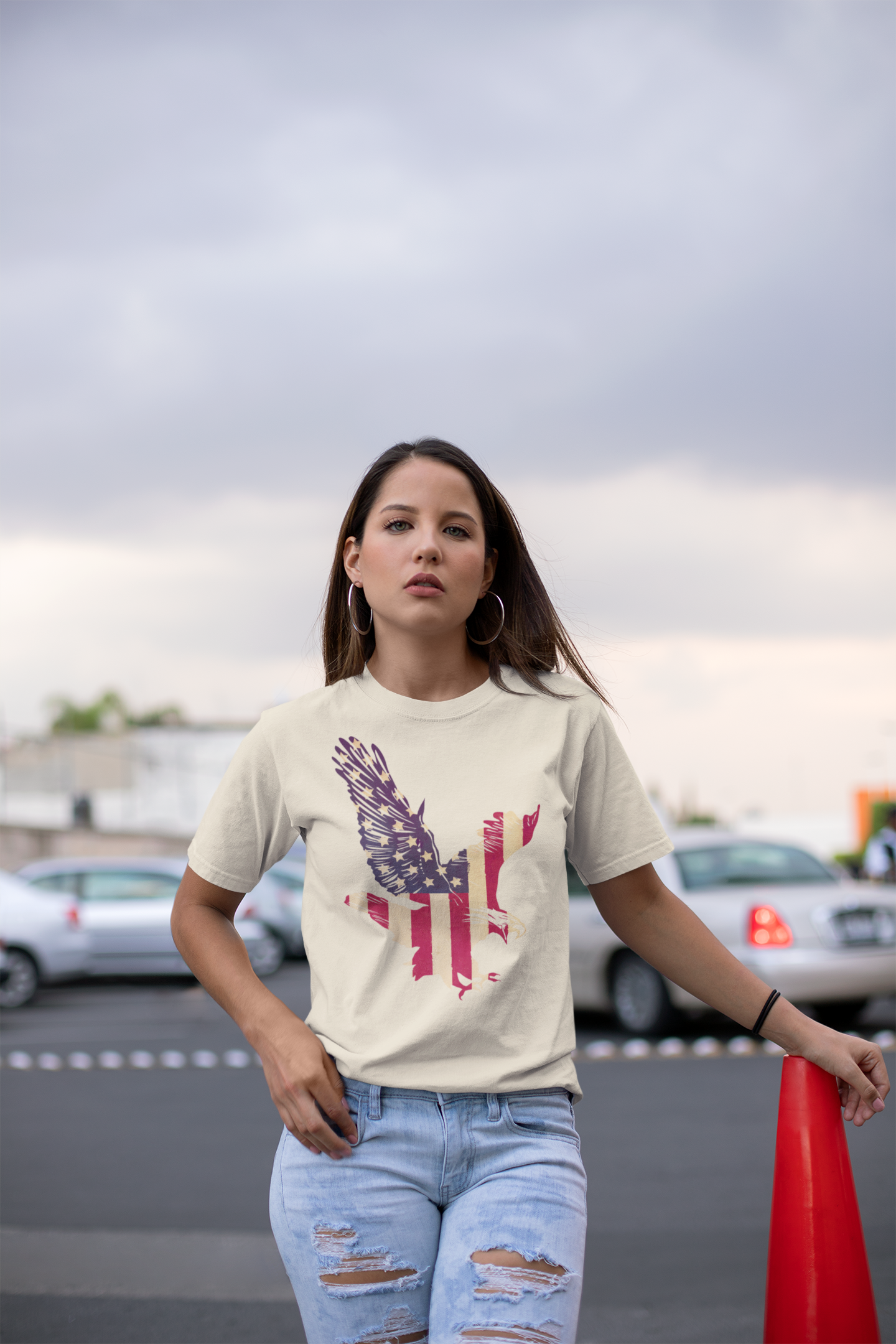 Woman wearing a t-shirt with a graphic design outdoors