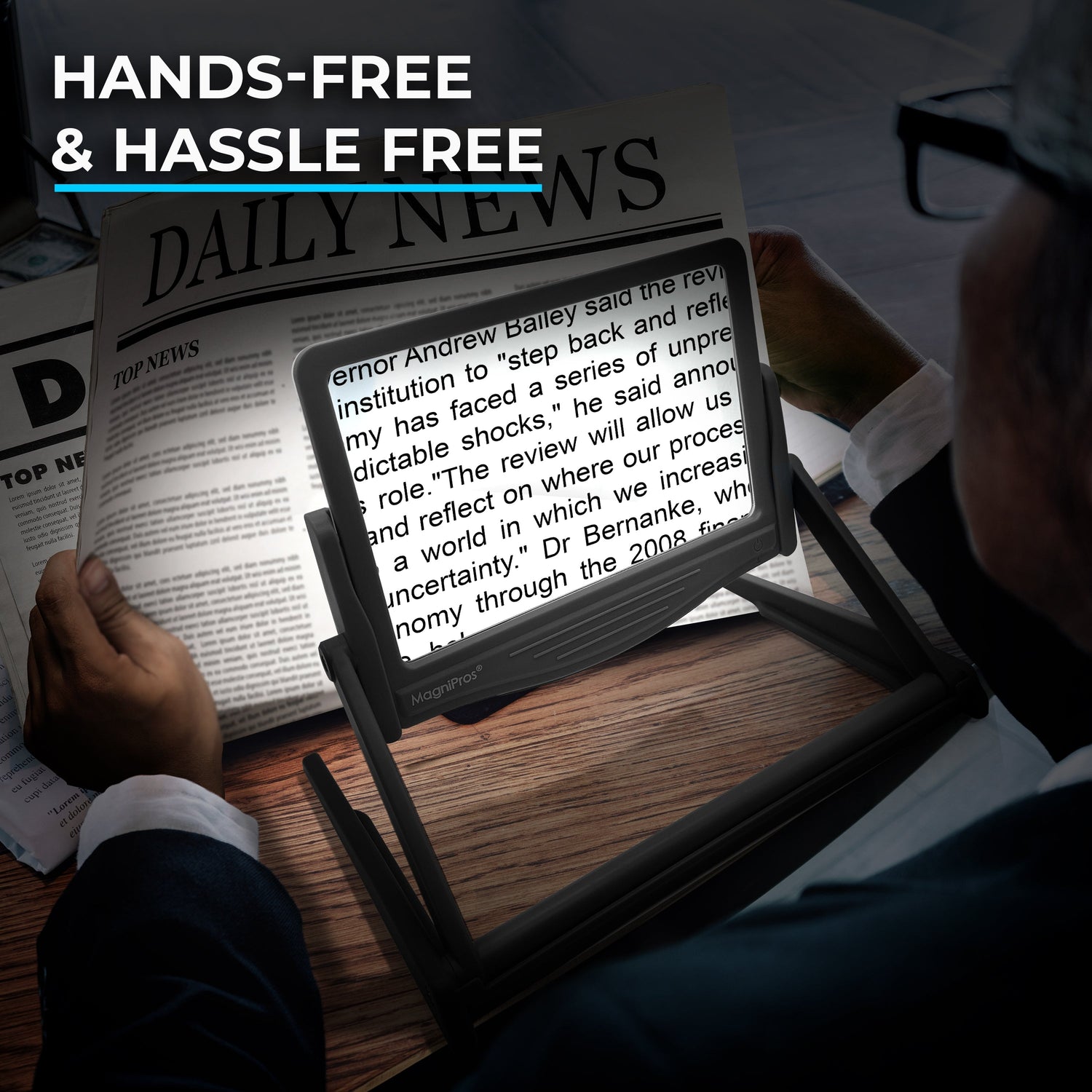 Person using a digital display to read text overlaying a newspaper, with 'Hands-Free & Hassle Free' text at the top.