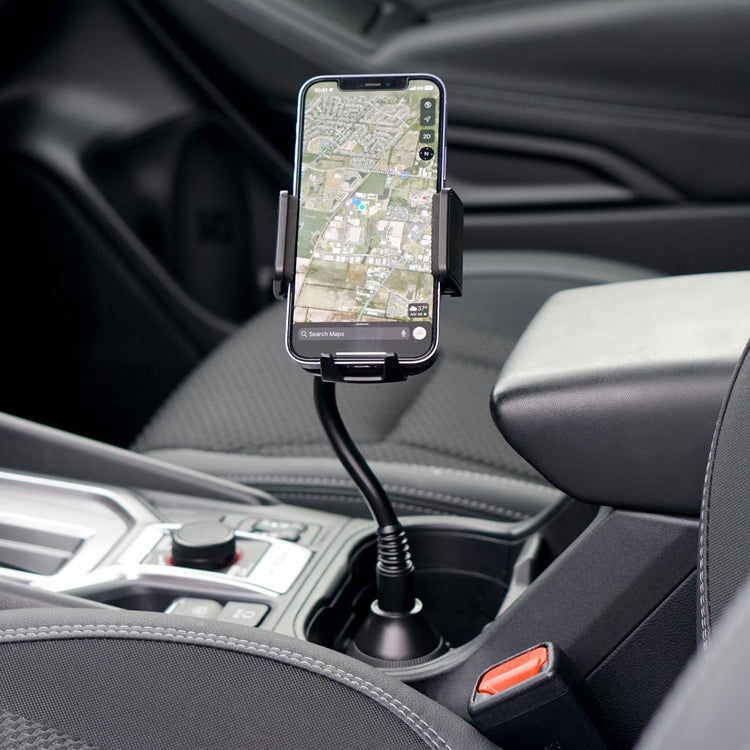 Phone mounted on a car dashboard with a map displayed