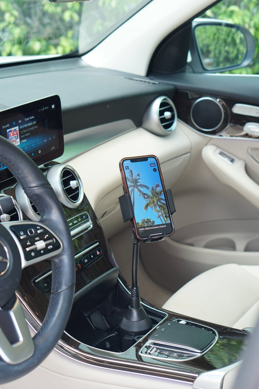 Black phone holder with cup holder on a white background