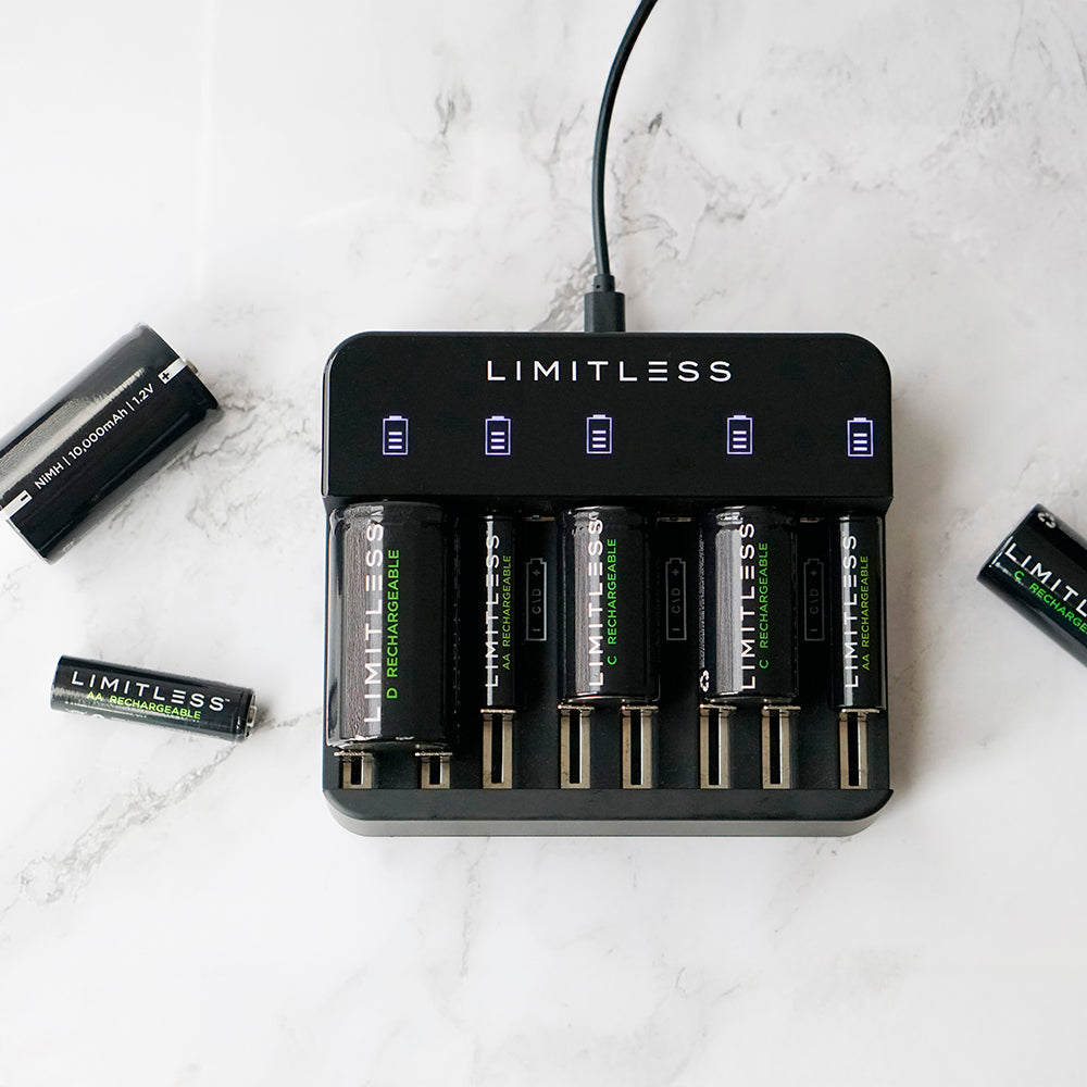 Limitless battery charger with batteries on a marble surface