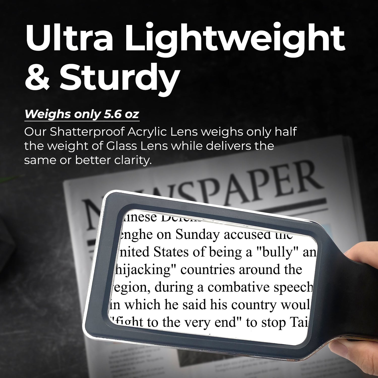 Handheld magnifying glass reading a newspaper with text about weight and durability.