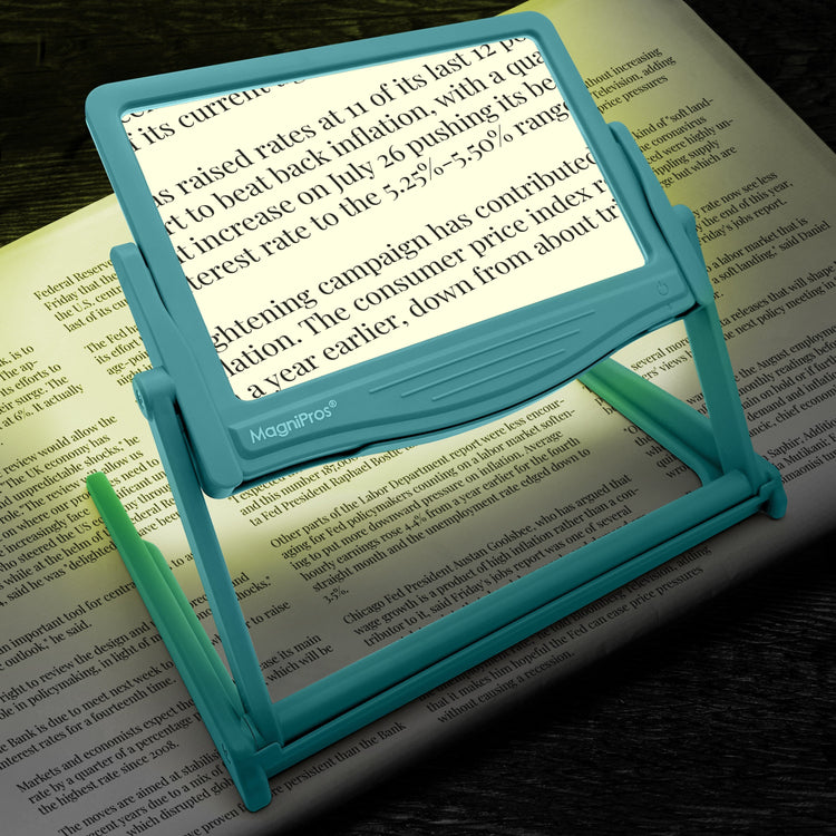 Blue MagniPros reading magnifier on a book with text