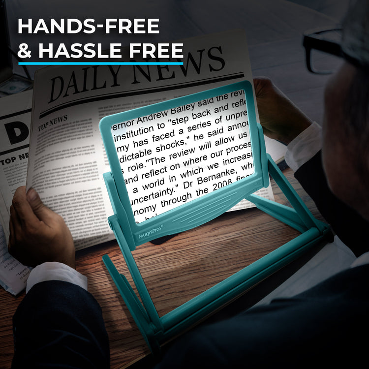 Person using a hands-free reading device with a newspaper in the background