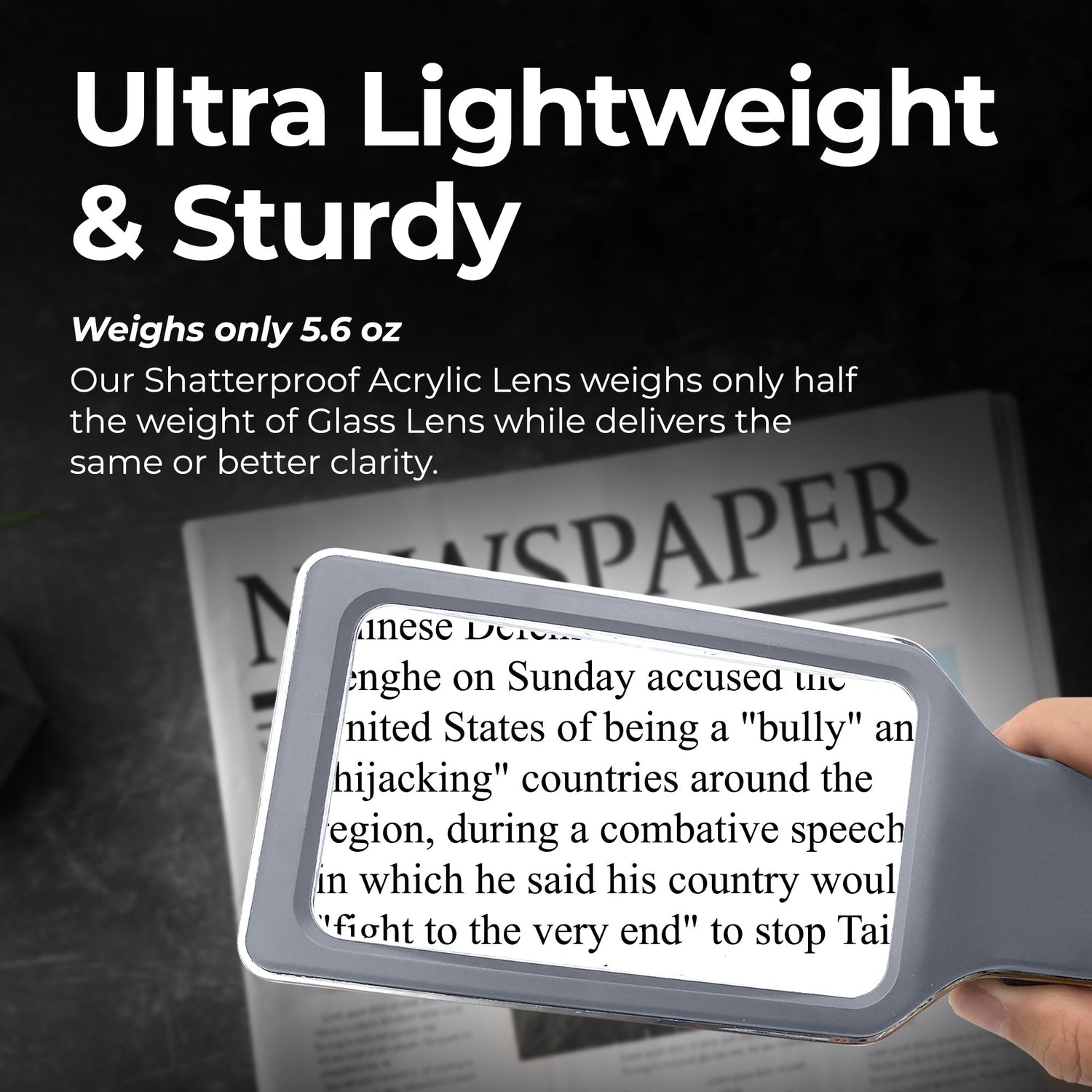 Sunglasses held over a newspaper with text about weight and clarity, on a dark background.