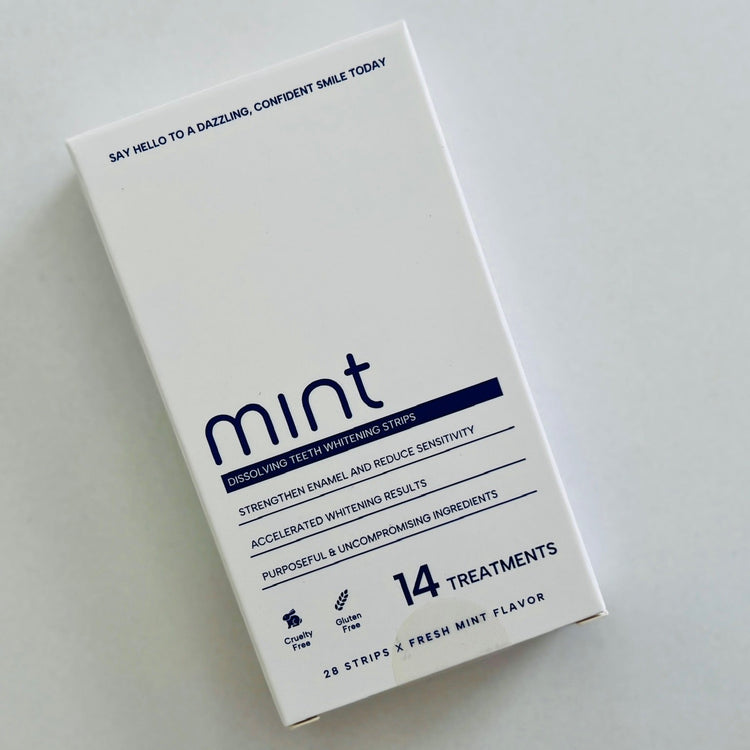 Box of Mint dissolving teeth whitening strips on a white background