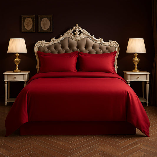 Neatly made bed with white bedding and pillows in a room with wooden nightstands and lamps.