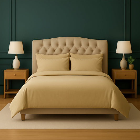 Neatly made bed with white bedding and pillows in a room with wooden nightstands and lamps.