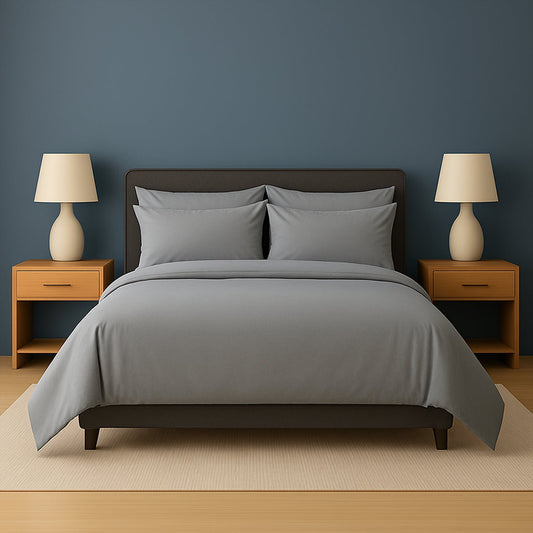 Neatly made bed with white bedding and pillows in a room with wooden nightstands and lamps.
