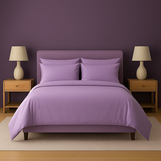 Dark-themed bedroom with black bedding, nightstands, and lamps.