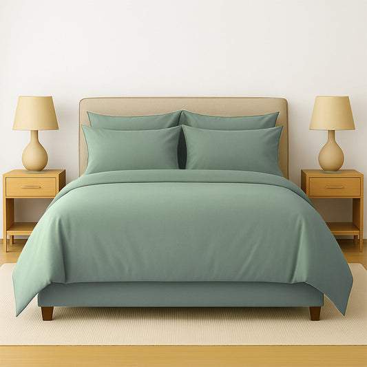 Neatly made bed with beige bedding in a bedroom setting.