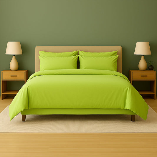 Purple bedding set on a bed with matching pillows in a room with purple walls and wooden nightstands.