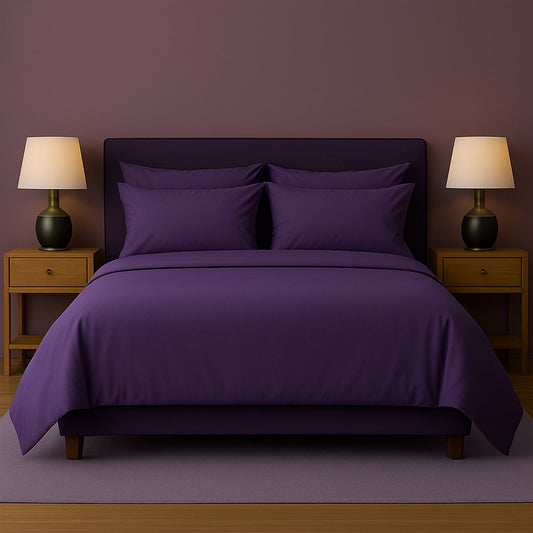 Neatly made bed with white bedding and pillows in a room with wooden nightstands and lamps.