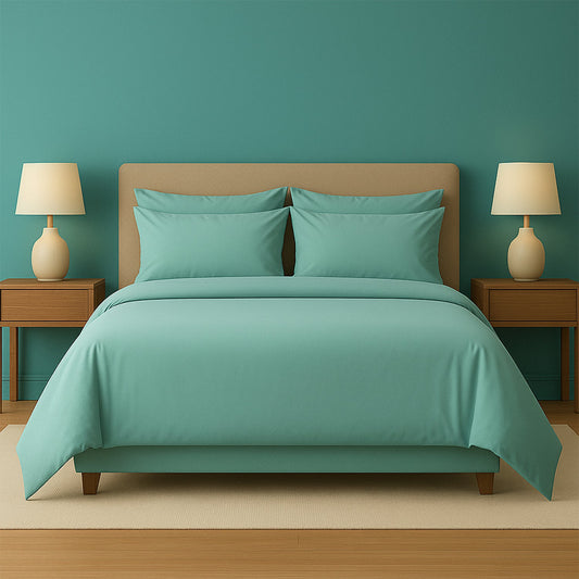 Neatly made bed with white bedding and pillows in a room with wooden nightstands and lamps.