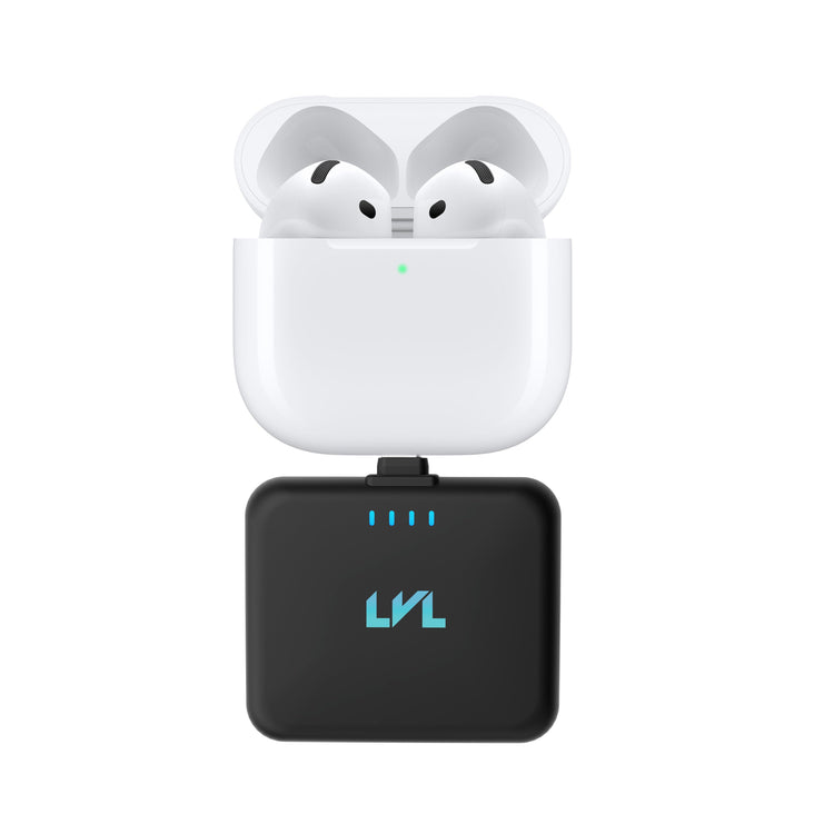 Wireless earbuds in a charging case with a black adapter on a white background