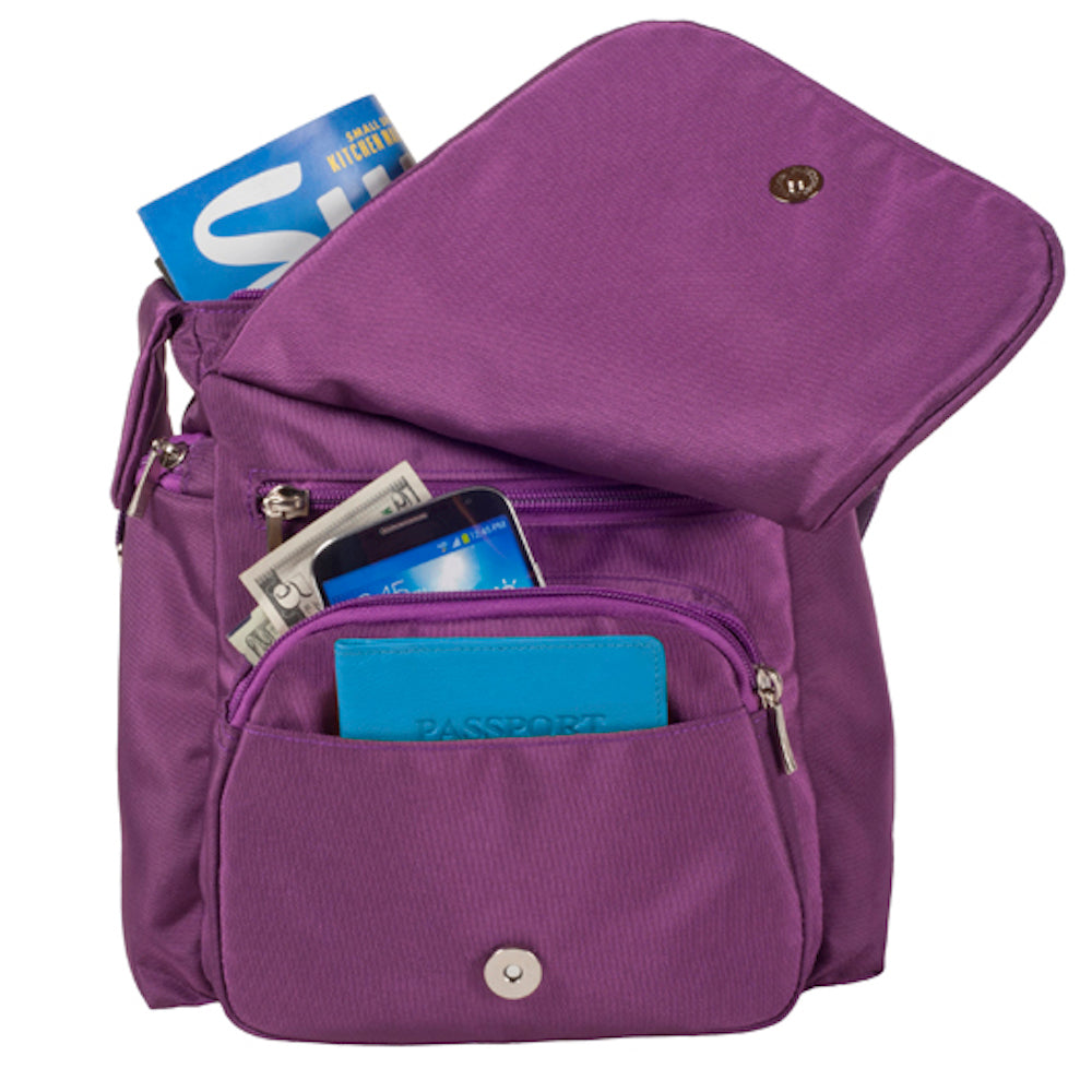 Purple bag with various items inside on a white background