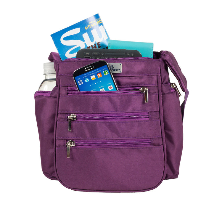 Purple bag with various items including a phone and bottle.
