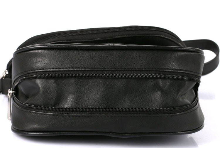 Black leather bag with zippers on a white background