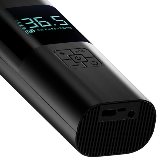 Black digital tire pressure monitor with digital display on a white background