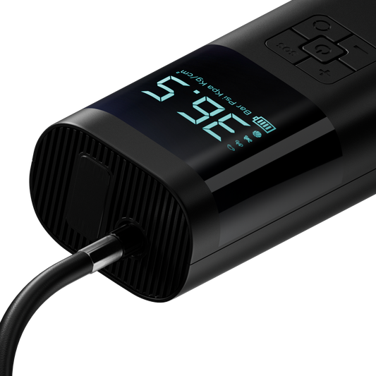 Black digital tire pressure monitor with digital display on a white background