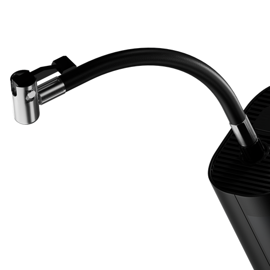 Black digital tire pressure monitor with digital display on a white background