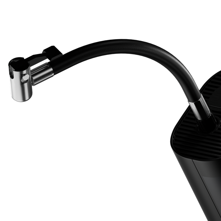 Modern kitchen faucet with a black hose on a white background